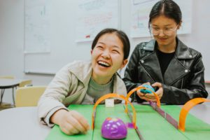 School of Education students exploring the robot toys