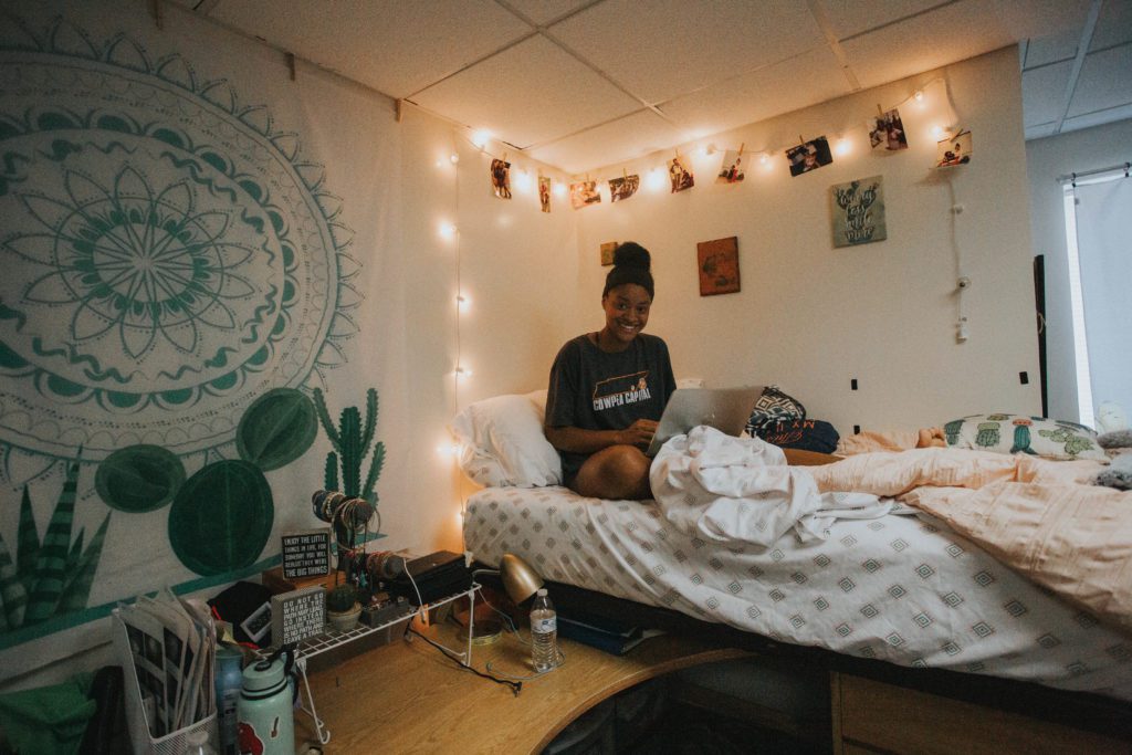 student studying in dorm room
