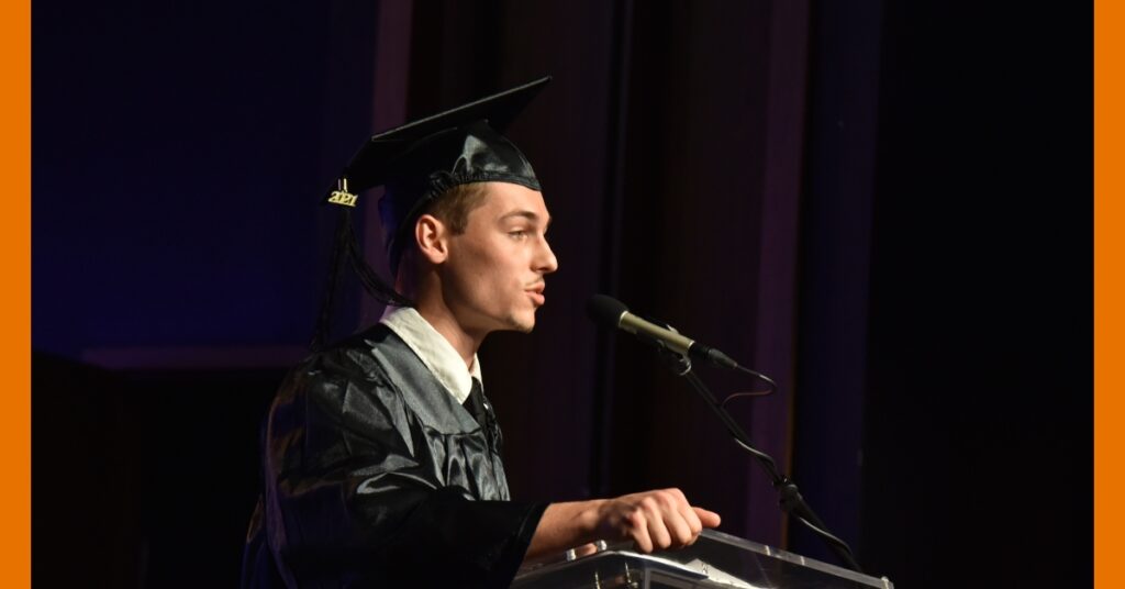 student speaking at JUFL Commencement